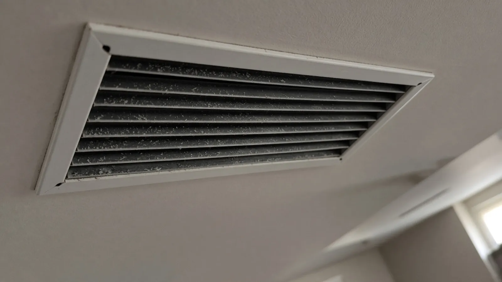 Ceiling air vent photographed on a phone